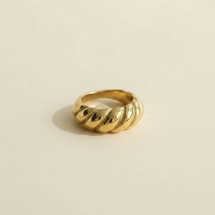 18K gold PVD croissant twisted dome ring shown alone in a studio product image