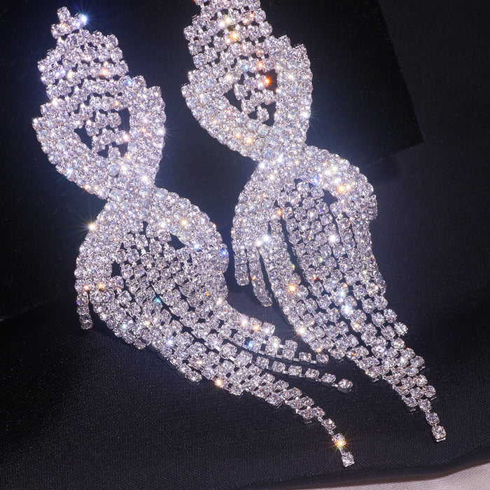 Crystal Infinity Twist Tassel Drop Earrings | Rhinestone Fringe Statement Earrings