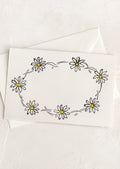 A greeting card with hand drawn image of a daisy chain, no text.