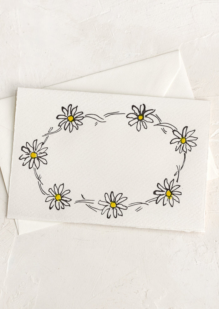 A greeting card with hand drawn image of a daisy chain, no text.