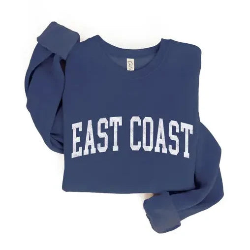 A navy blue cropped sweatshirt with 'EAST COAST' printed in white arched block letters across the chest, shown on a plain white background.