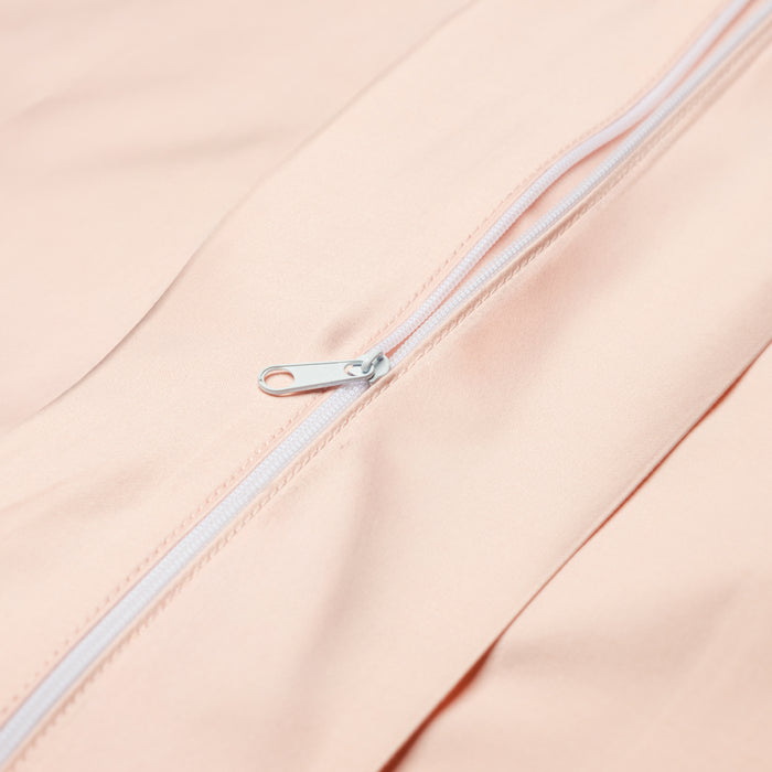 Close-up of the Eco Deluxe Bed Linens Duvet Cover in peach and cream