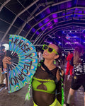 House X Techno hand fan held at festival psychedelic swirl design