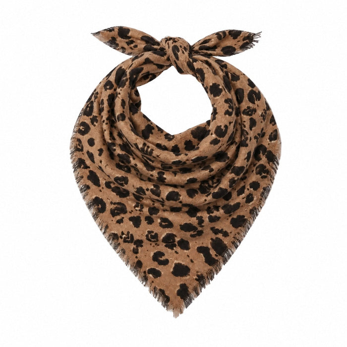 Kerri Rosenthal leopard print bandana worn tied around the neck over a denim jacket