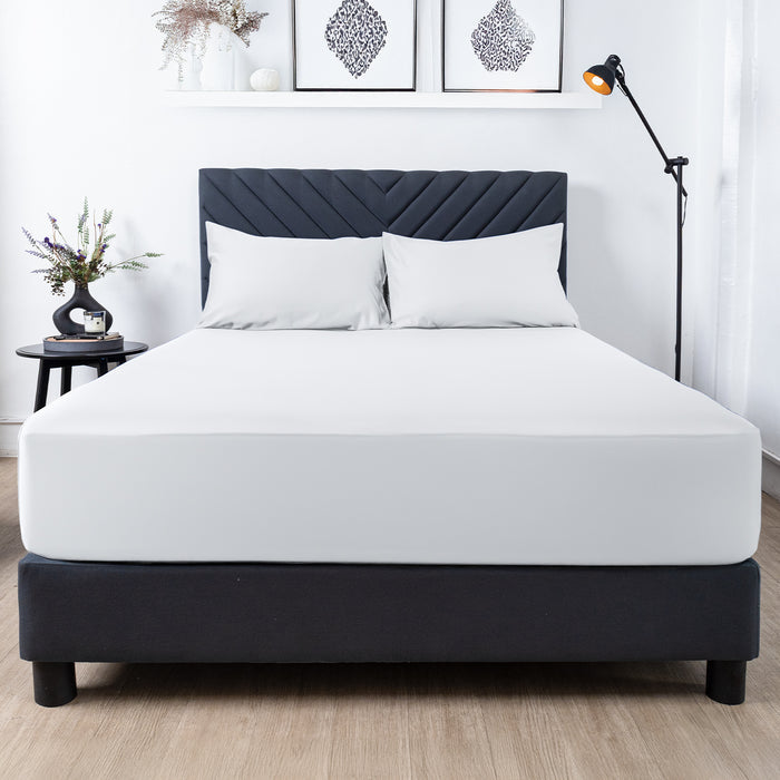 Premium Touch Bed Linens 3 Piece Fitted Sheet Set in white, shown in a room setting
