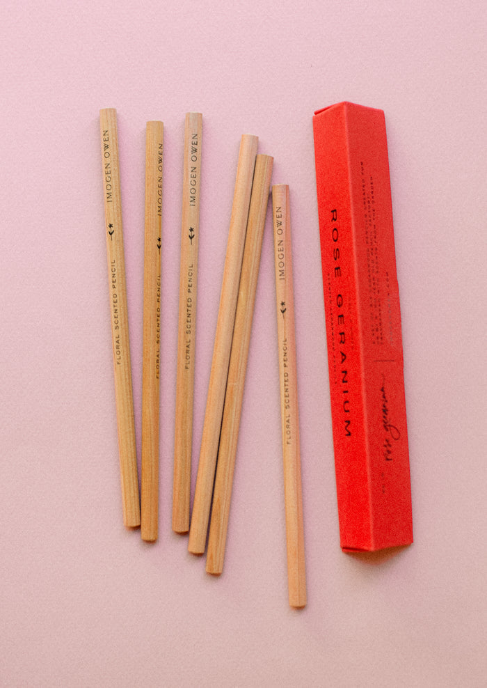 A red box with pencils.