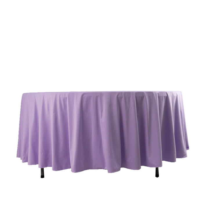 Purple round tablecloth on a plain backdrop