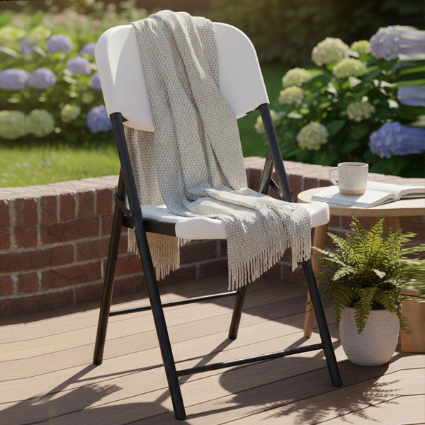 Uratex Monoblock Aiko Folding Chair, shown in a room setting