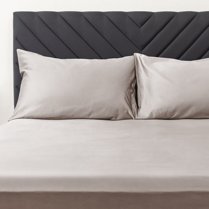 Wink Bed Linens 2 Piece Pillowcase Set in gray, shown in a room setting