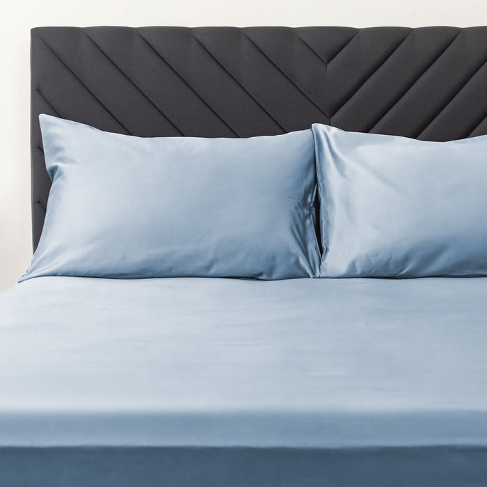 Wink Bed Linens 2 Piece Pillowcase Set in blue, shown in a room setting