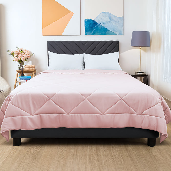 Wink Bed Linens Comforter in pink, shown in a room setting