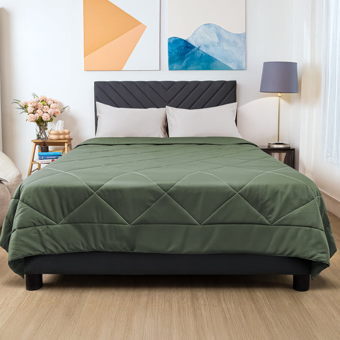 Wink Bed Linens Comforter in green, shown in a room setting